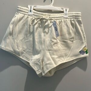 NWT Pink Shorts. Embroided  leg with flowers